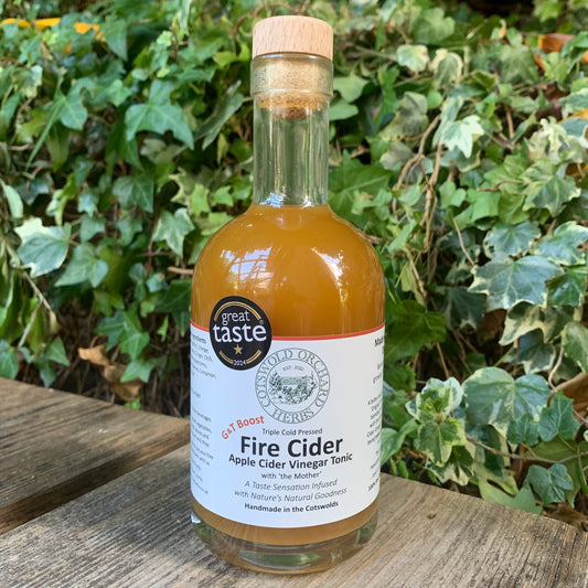 Front-facing 350ml bottle of G&T Boost Fire Cider – triple cold pressed apple cider vinegar tonic with herbs and spices, Great Taste award winner, handmade in the Cotswolds