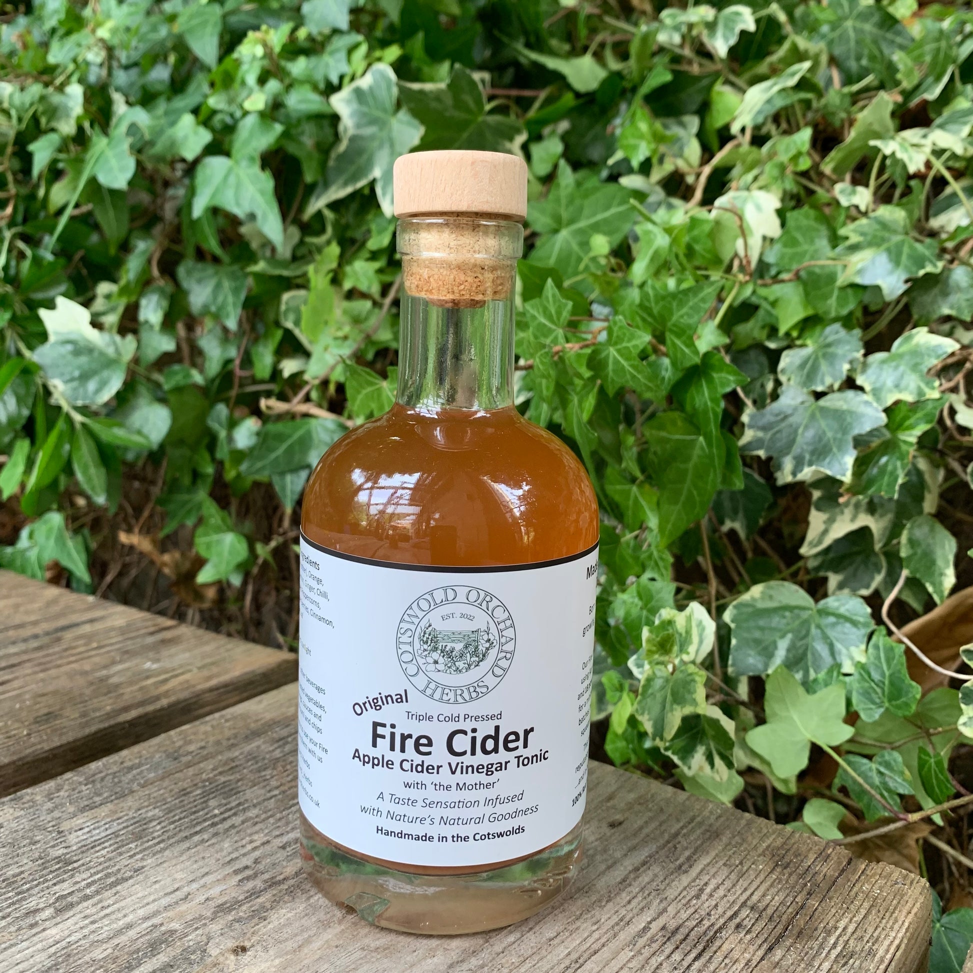 Front-facing 250ml bottle of Original Fire Cider – triple cold pressed apple cider vinegar tonic with natural herbs, handmade in the Cotswolds by Cotswold Orchard Herbs